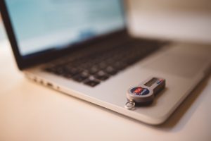 Personal identification verification sitting on Apple Laptop